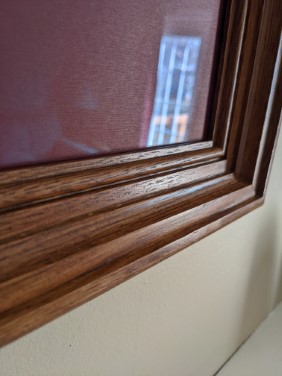 angled shot of picture frame corner also known as a miter joint